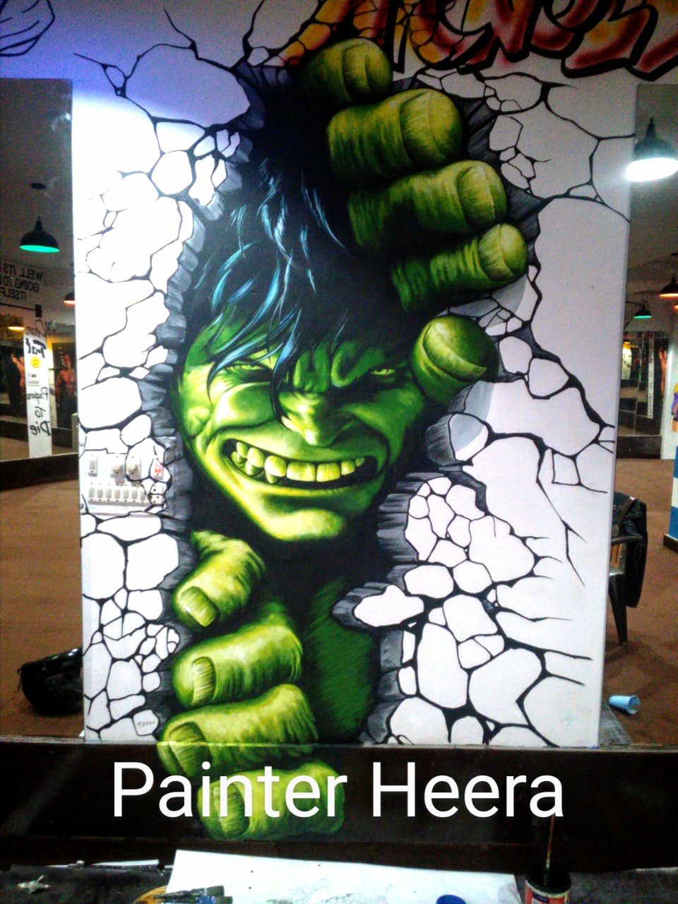 graffiti artist in Noida painting wall mural